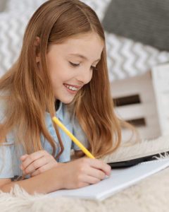 girl writing in notebook